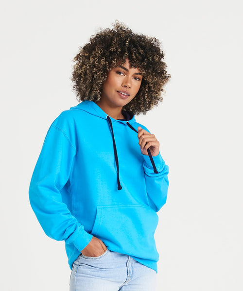 Person wearing a bright blue hoodie with a neutral background